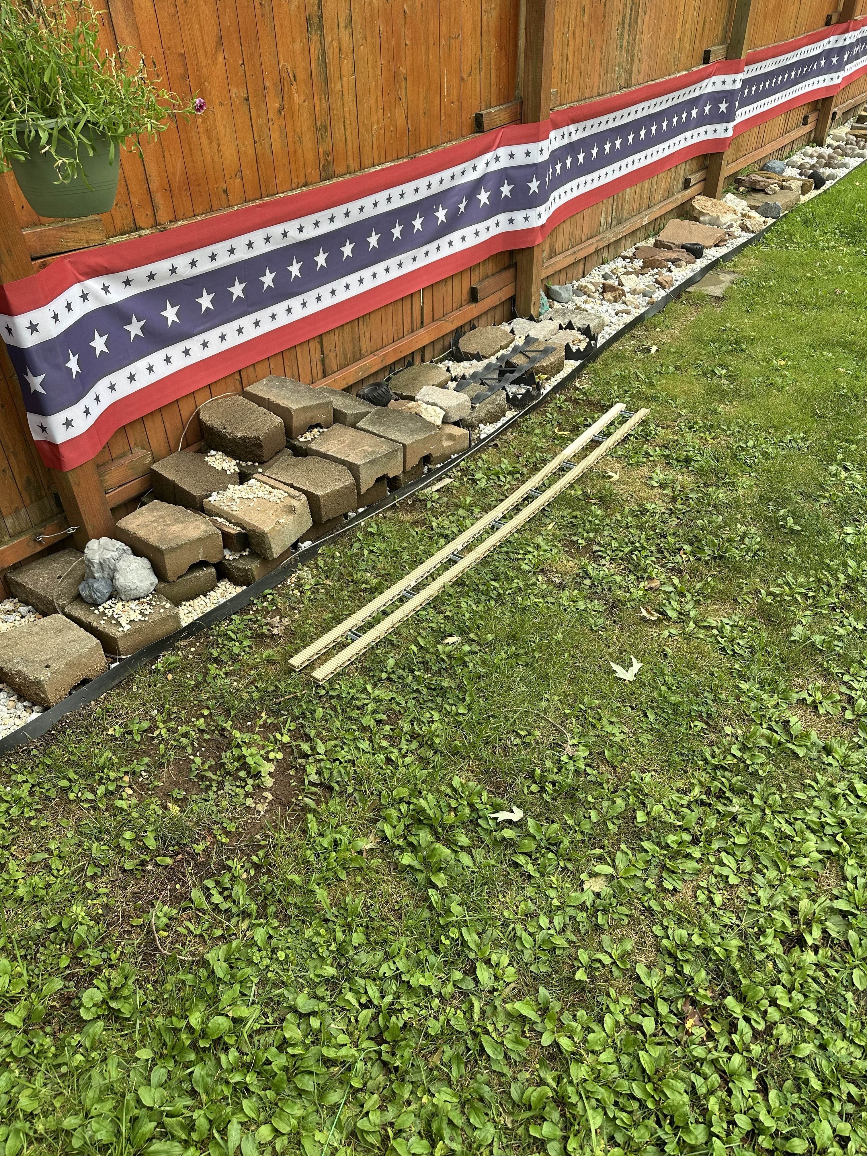 Trestle of Doom rail sections staged beside the crawler course fence line