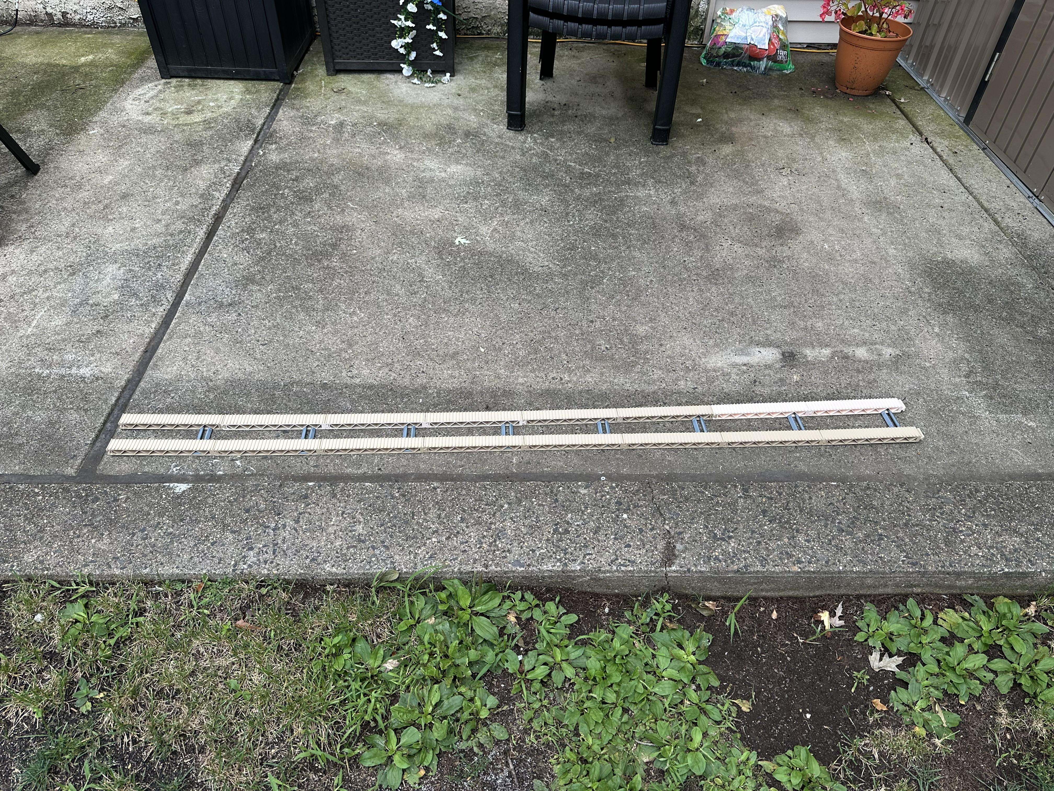 Trestle of Doom modular rail sections laid out on the patio